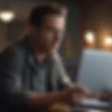 A thoughtful individual evaluating multiple insurance quotes on a laptop