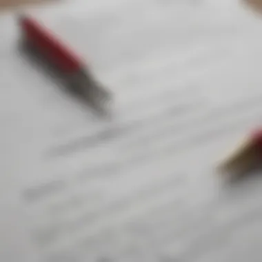Close-up of a real estate contract and a pen ready for signing