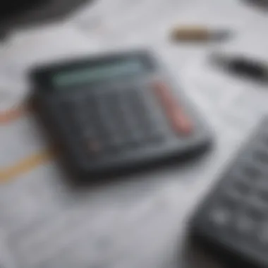 A close-up of financial documents and a calculator, representing personal finance management.